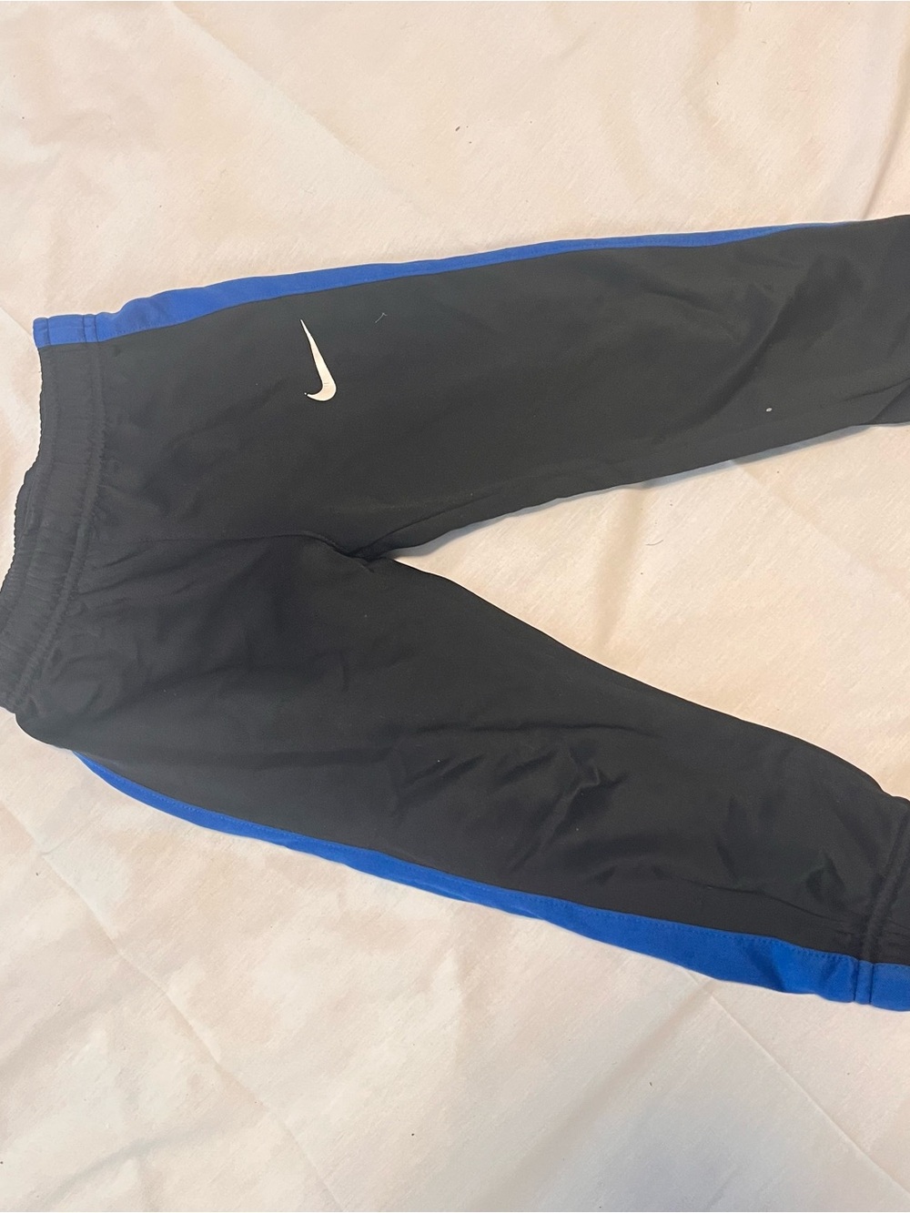 Nike Kids Black Joggers with Blue Side Stripe
